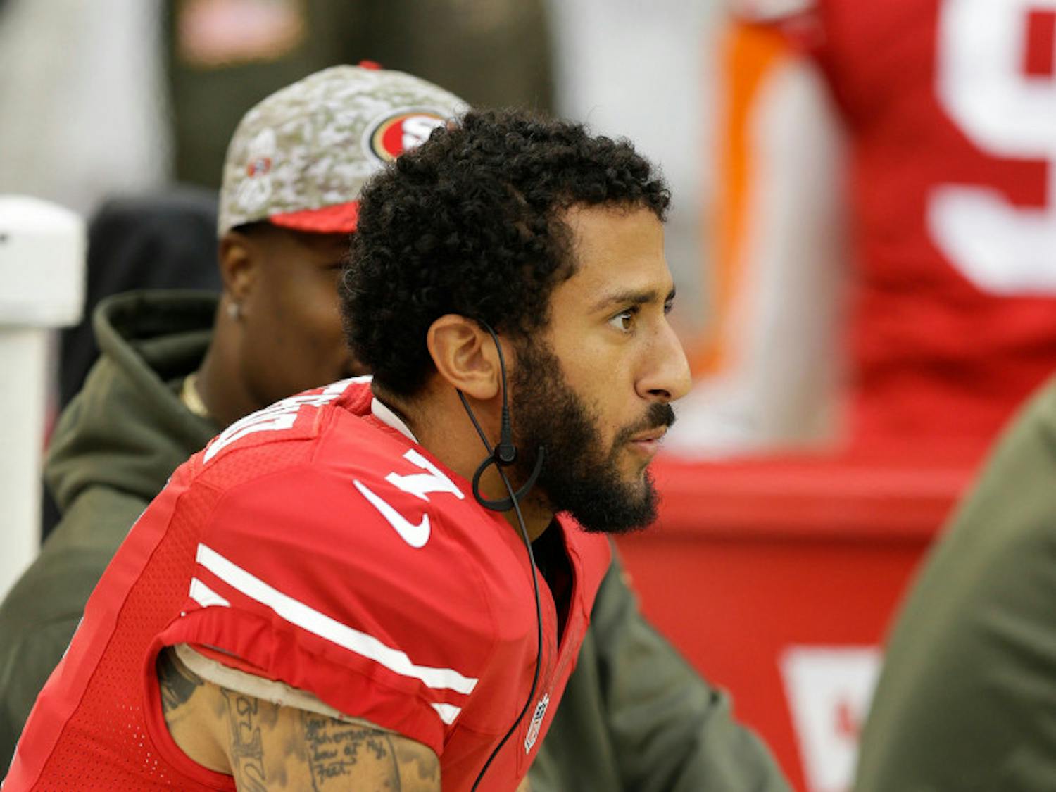 FILE--In this Nov. 8, 2015, file photo, San Francisco 49ers quarterback Colin Kaepernick sits on the sideline during the second half of an NFL football game against the Atlanta Falcons in Santa Clara, Calif. A northern Nevada airport is getting an earful about a decorative display that, in part, highlights Kaepernick, a treasured product of the University of Nevada's football program who in recent days has been in the spotlight over his decision to sit down during the national anthem. (AP Photo/Ben Margot, File)