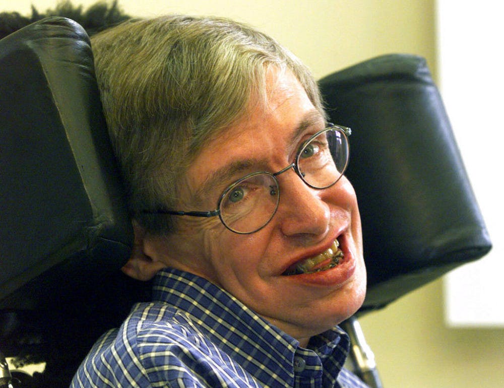 In this Wednesday, July 21, 1999 file photo Professor Stephen Hawking smiles during a news conference at the University of Potsdam, near Berlin, Germany. Hawking, whose brilliant mind ranged across time and space though his body was paralyzed by disease, has died, a family spokesman said early Wednesday, March 14, 2018.