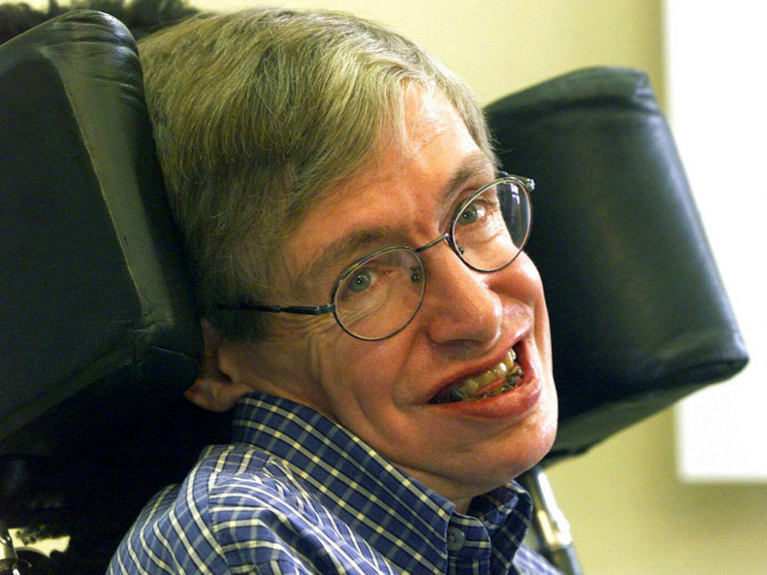 In this Wednesday, July 21, 1999 file photo Professor Stephen Hawking smiles during a news conference at the University of Potsdam, near Berlin, Germany. Hawking, whose brilliant mind ranged across time and space though his body was paralyzed by disease, has died, a family spokesman said early Wednesday, March 14, 2018.