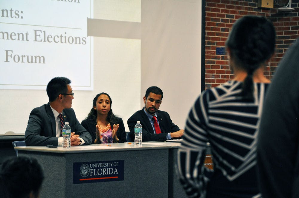 Access Party executive candidates Kevin Doan, Joselin Padron-Rasines and Nicholas Carre answer questions from the audience at an elections platform forum sponsored by the Asian American Student Union on Thursday.