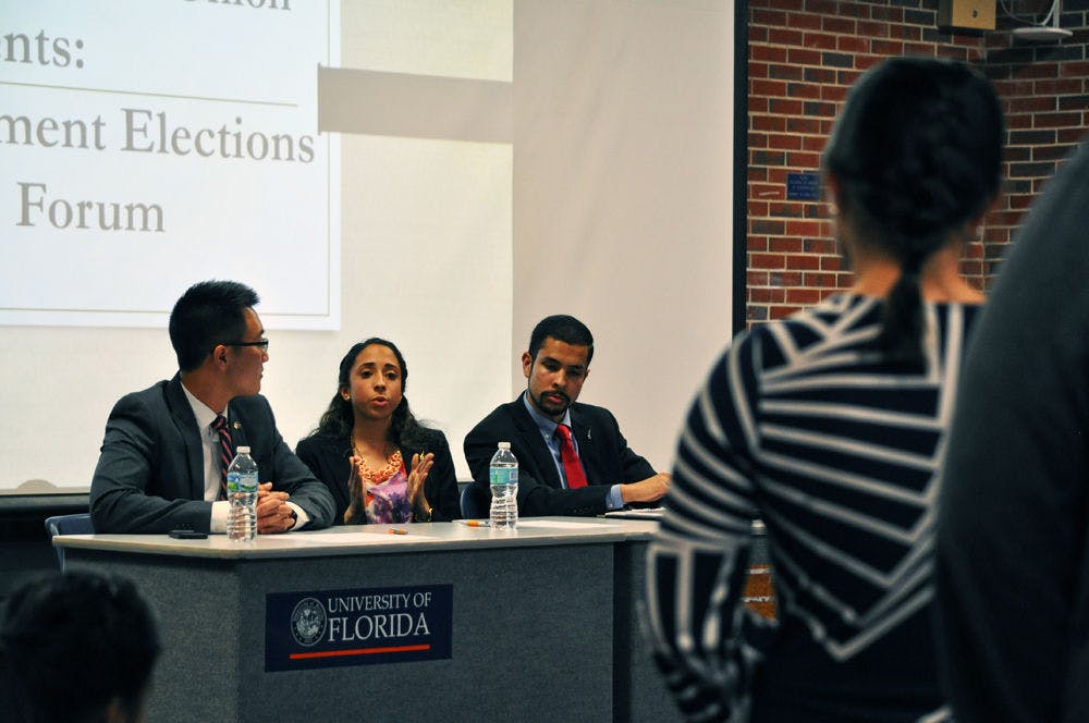 <p>Access Party executive candidates Kevin Doan, Joselin Padron-Rasines and Nicholas Carre answer questions from the audience at an elections platform forum sponsored by the Asian American Student Union on Thursday.</p>