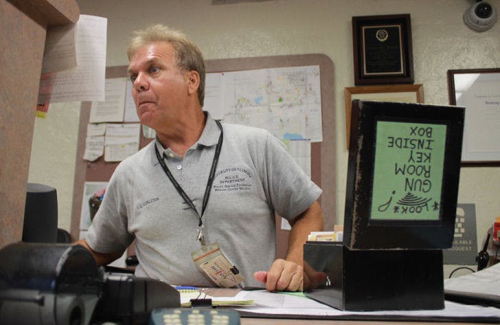 Steve Middleton mans UPD’s front desk Wednesday afternoon. Students who live on campus and own guns are required to turn in their firearms at the desk before moving in.