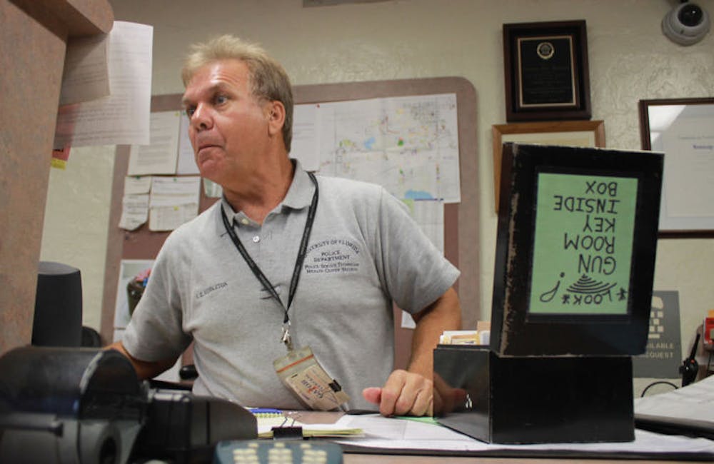 <p>Steve Middleton mans UPD’s front desk Wednesday afternoon. Students who live on campus and own guns are required to turn in their firearms at the desk before moving in.</p>