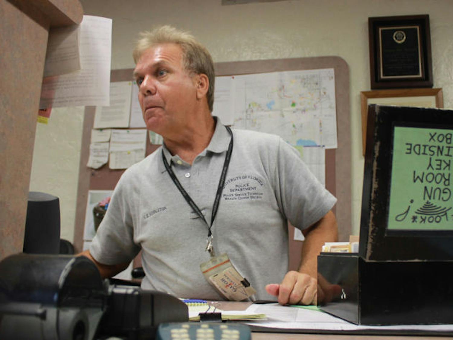 Steve Middleton mans UPD’s front desk Wednesday afternoon. Students who live on campus and own guns are required to turn in their firearms at the desk before moving in.