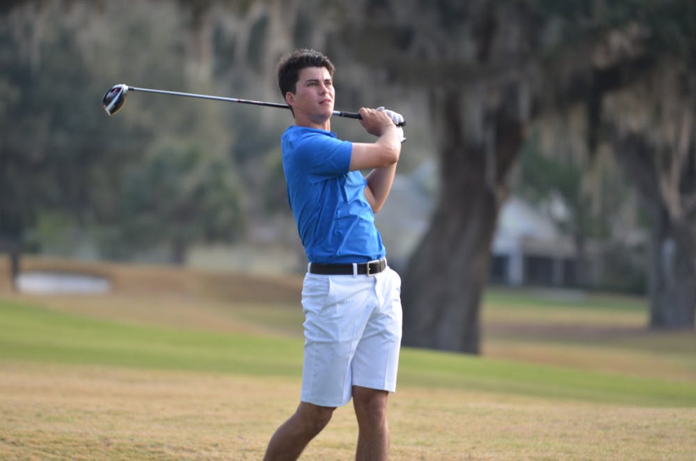 <p>Freshman Gordon Neale hits a ball during Day 2 of the SunTrust Gator Invitational on Feb. 21, 2016, at the Mark Bostic Golf Course. </p>