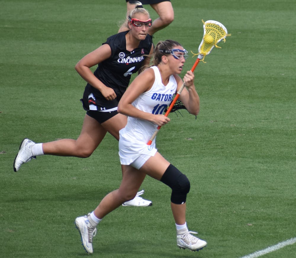 <p>Danielle Pavinelli plays against Cincinnati March 26. She scored her 100th goal of her career at UF Sunday.</p>