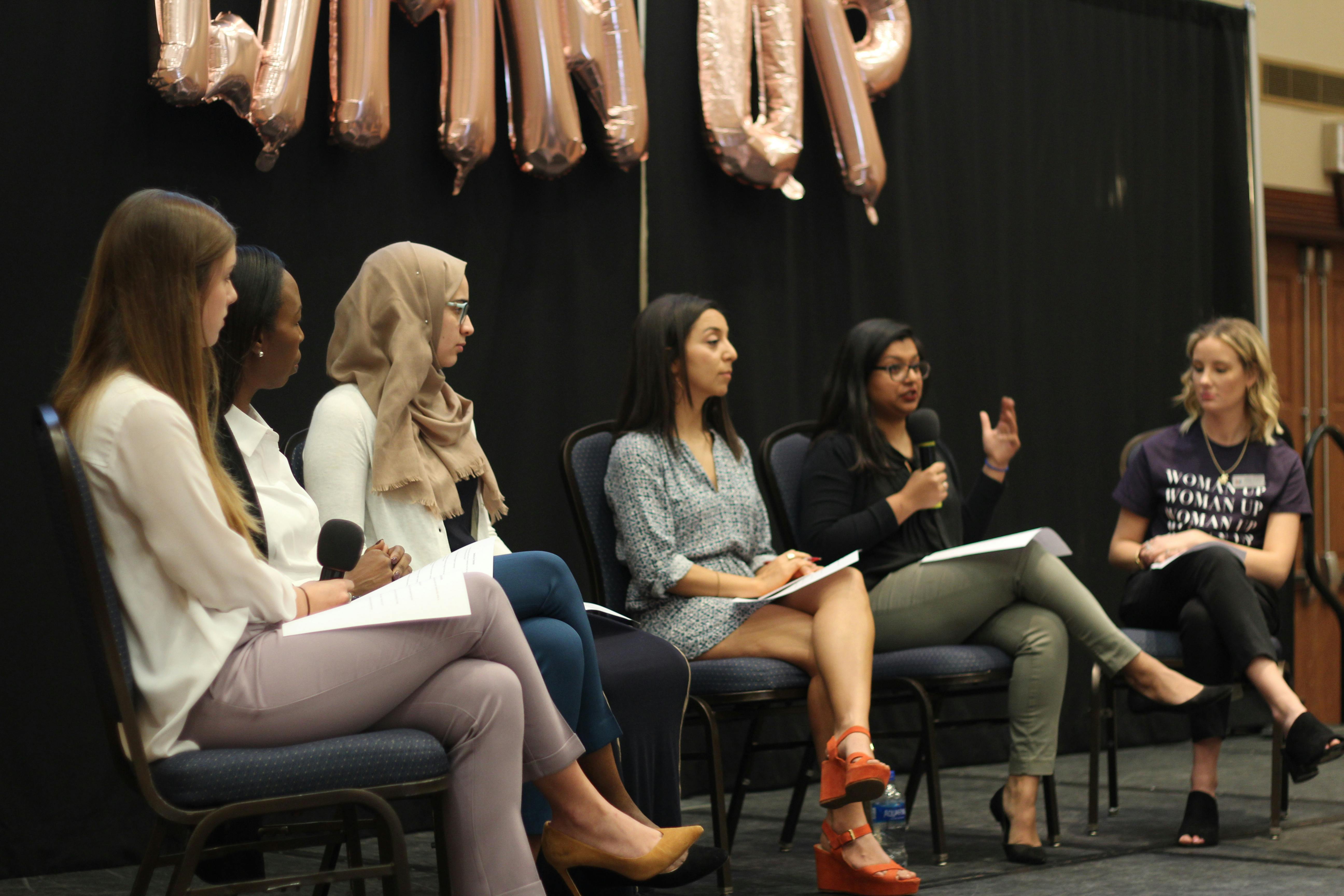 (Left to right) Panelists Julia Van de Bogart, Mira Lowe, Sana Nimer, Diana Moreno and Dhara Patel talk with a UF Women’s Student Association member about women empowerment in the workplace, women standing up for themselves and encouraging other women during a discussion Sunday in the Reitz Union Grand Ballroom. About 70 people attended the talk.