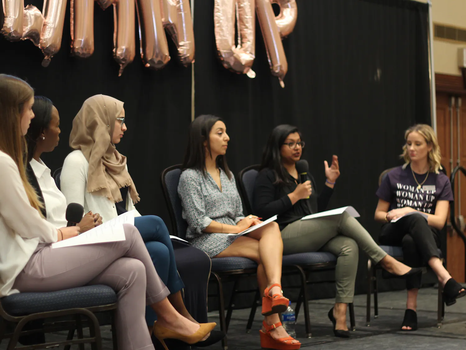 (Left to right) Panelists Julia Van de Bogart, Mira Lowe, Sana Nimer, Diana Moreno and Dhara Patel talk with a UF Women’s Student Association member about women empowerment in the workplace, women standing up for themselves and encouraging other women during a discussion Sunday in the Reitz Union Grand Ballroom. About 70 people attended the talk.