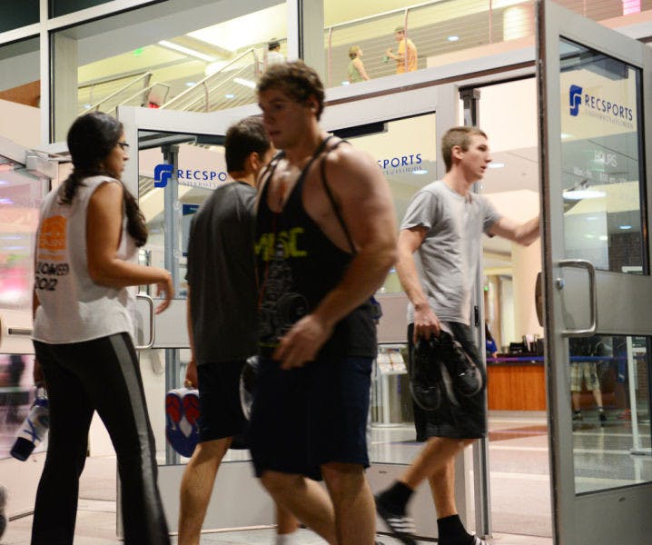 Students walk in and out of Southwest Recreation Center on Monday afternoon. About 39,000 people visited campus gyms last week.
