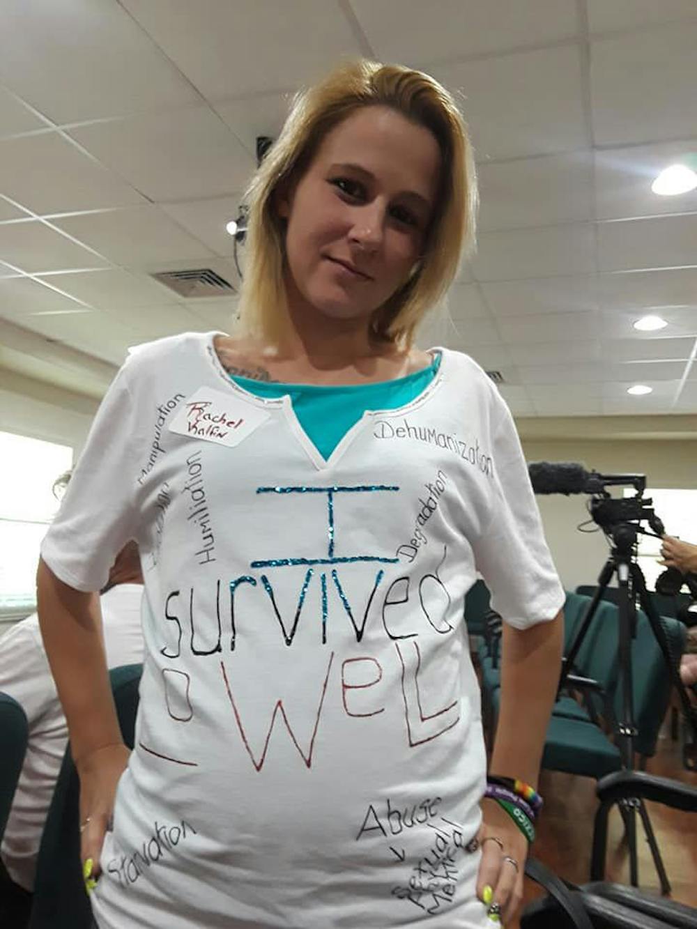 <p><span id="docs-internal-guid-265fb168-7fff-e0c2-1fbe-5dc7306dacdd"><span>Rachel Kalfin, a former inmate at Lowell Correctional Institution, poses in her “I survived Lowell” shirt. On August 19, she attended a meeting in Ocala with other former inmates to talk to the Department of Justice team about abuses they experienced.</span></span></p>