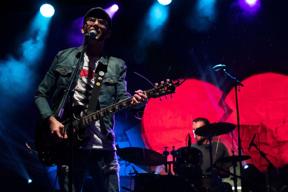 Matt Burke, lead vocalist for Have Gun, Will Travel, performs with his band at Depot Park during the first night of the Tom Petty Birthday Bash on Friday night. The event was founded to commemorate the life of Gainesville native and musician Tom Petty.