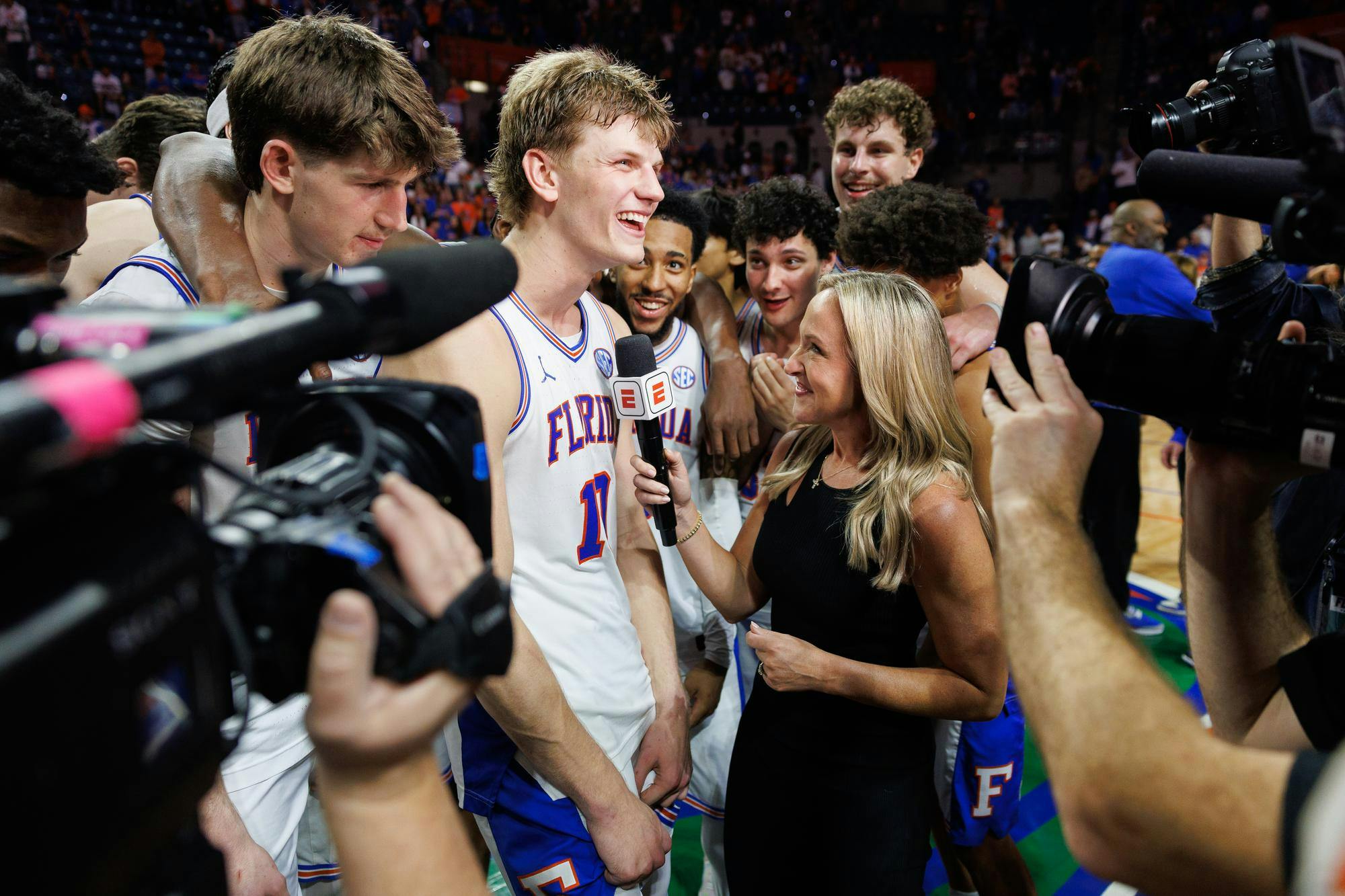 Florida forward Thomas Haugh (10) is interviewed by ESPN sideline reporter Kris Budden after clinching the Southeastern Conference Championship title by defeating Arkansas 111-77 in an NCAA basketball game, Saturday, Feb. 28, 2026, in Gainesville, Fla.