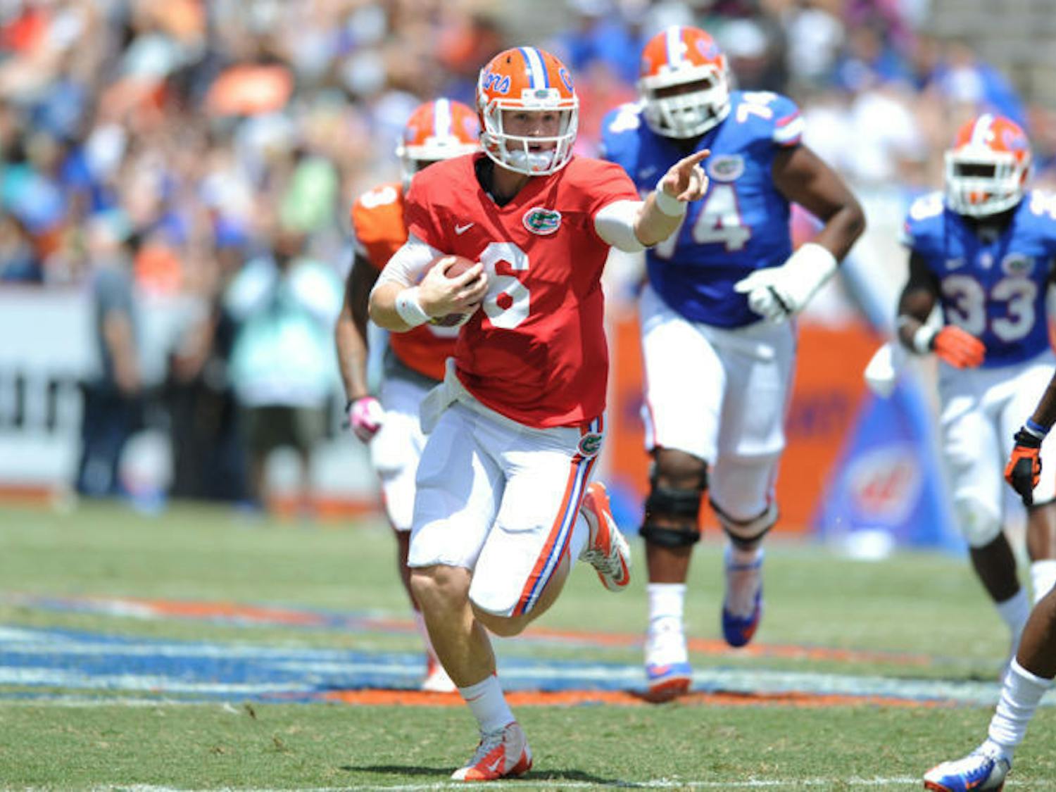 Jeff Driskel (6) signals down the field as he scrambles during Florida’s Orange and Blue Debut on Saturday at Ben Hill Griffin Stadium. Driskel suffered a fractured fibula against Tennessee on Sept. 21, 2013.