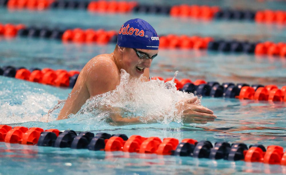 <p>Gators swimmer Kieran Smith comes up to breathe while swimming breaststroke. Smith pulled in seven medals Friday, including four gold</p>