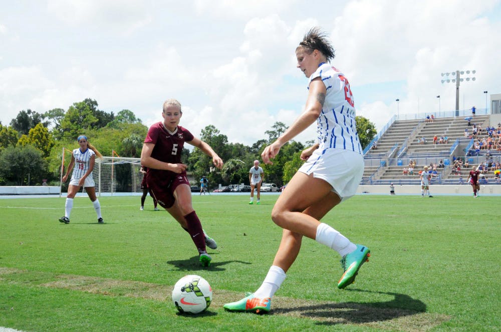 <p>UF midfielder Pamela Begic dribbles the ball while FSU's Elin Jensen (5) approaches during the first half of Florida's 3-2 win against Florida State on Aug. 30, 2015, at James G. Pressly Stadium.</p>