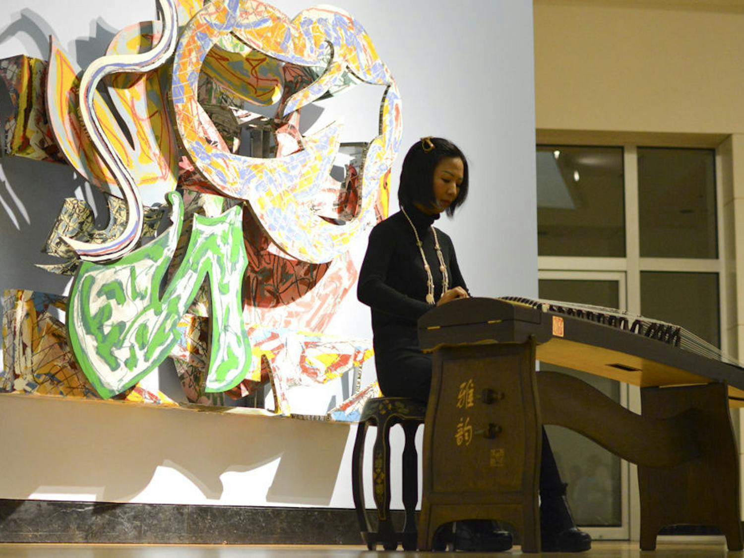 Liang Xiaodan plays the Chinese zither at the Samuel P. Harn Museum of Art.