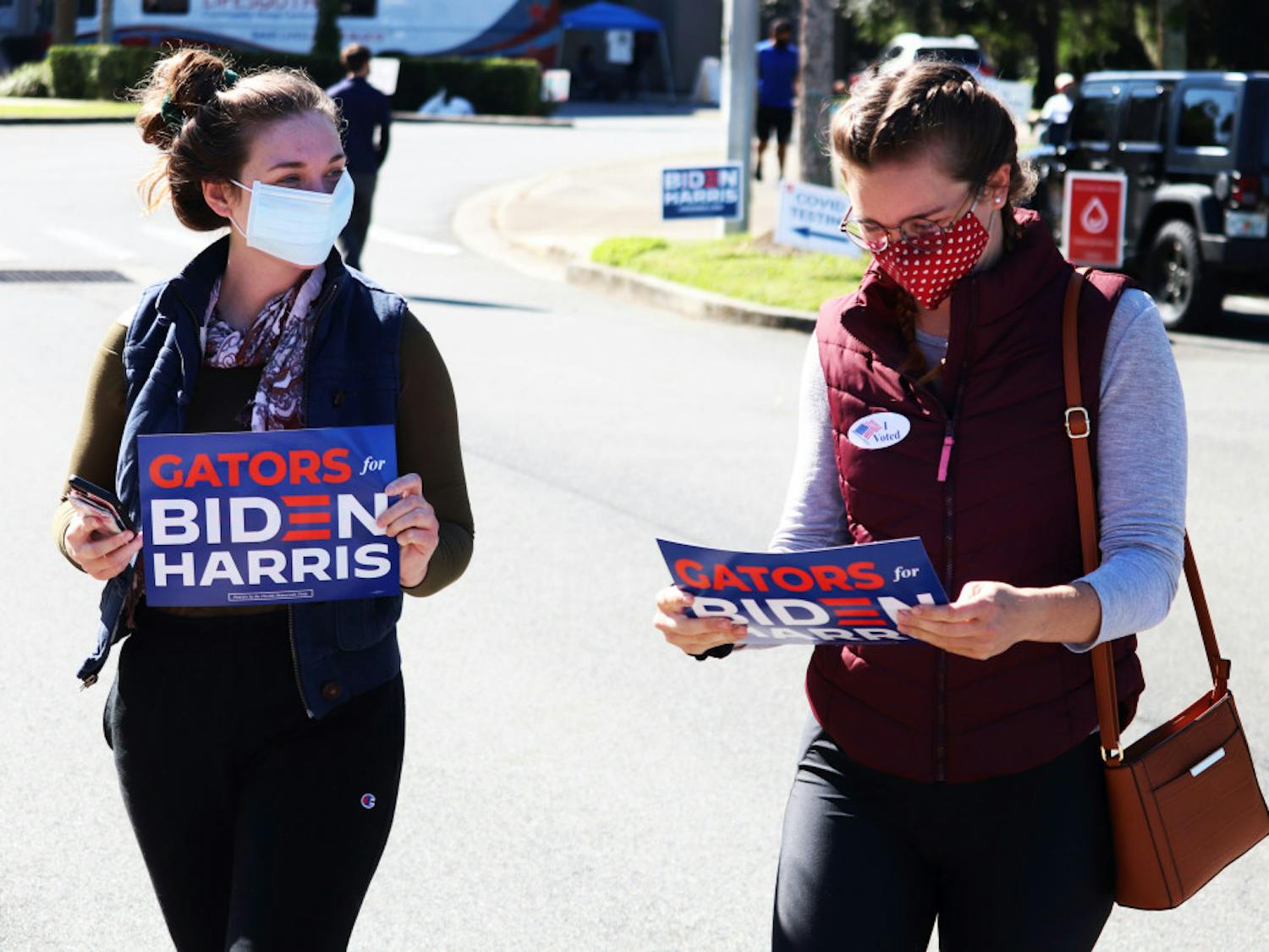 Two UF alumni leave precincts 44 and 54 after voting on Tuesday, Nov. 3, 2020.