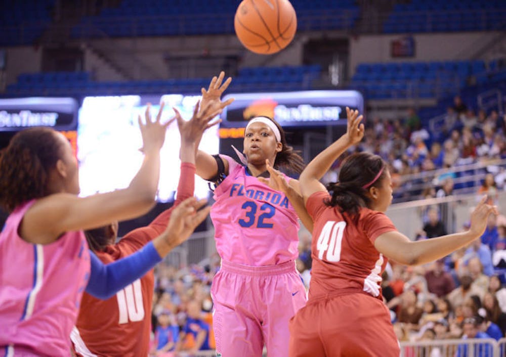 <p>Forward Jennifer George (32) attempts a pass during Florida’s 87-54 victory against Alabama on Feb. 3. The Gators improved to 4-6 in Southeastern Conference play on Sunday.</p>