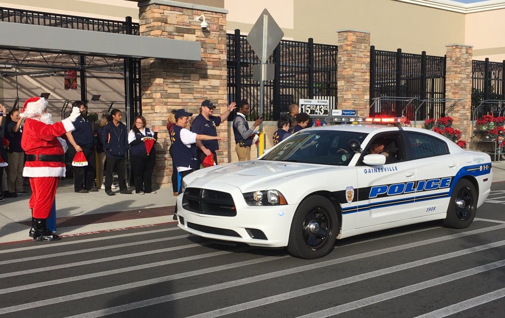 More than 20 Alachua County students arrived at Walmart in police cars. Santa along with an eager group of Walmart employees greeted them before they began shopping. 