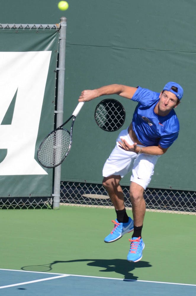 Gordon Watson serves during Florida's 9-3 win against William &amp; Mary.