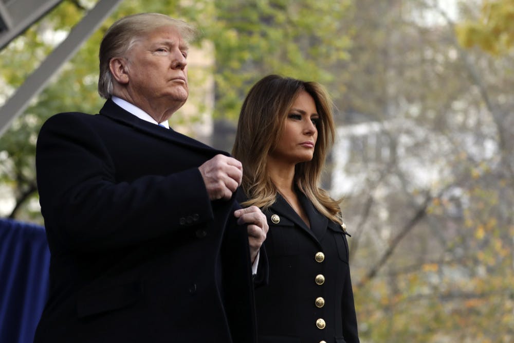 President Donald Trump and first lady Melania Trump attend ceremony at the New York City Veterans Day Parade at Madison Square Park in New York, Monday, Nov. 11, 2019. (AP Photo/Andrew Harnik)