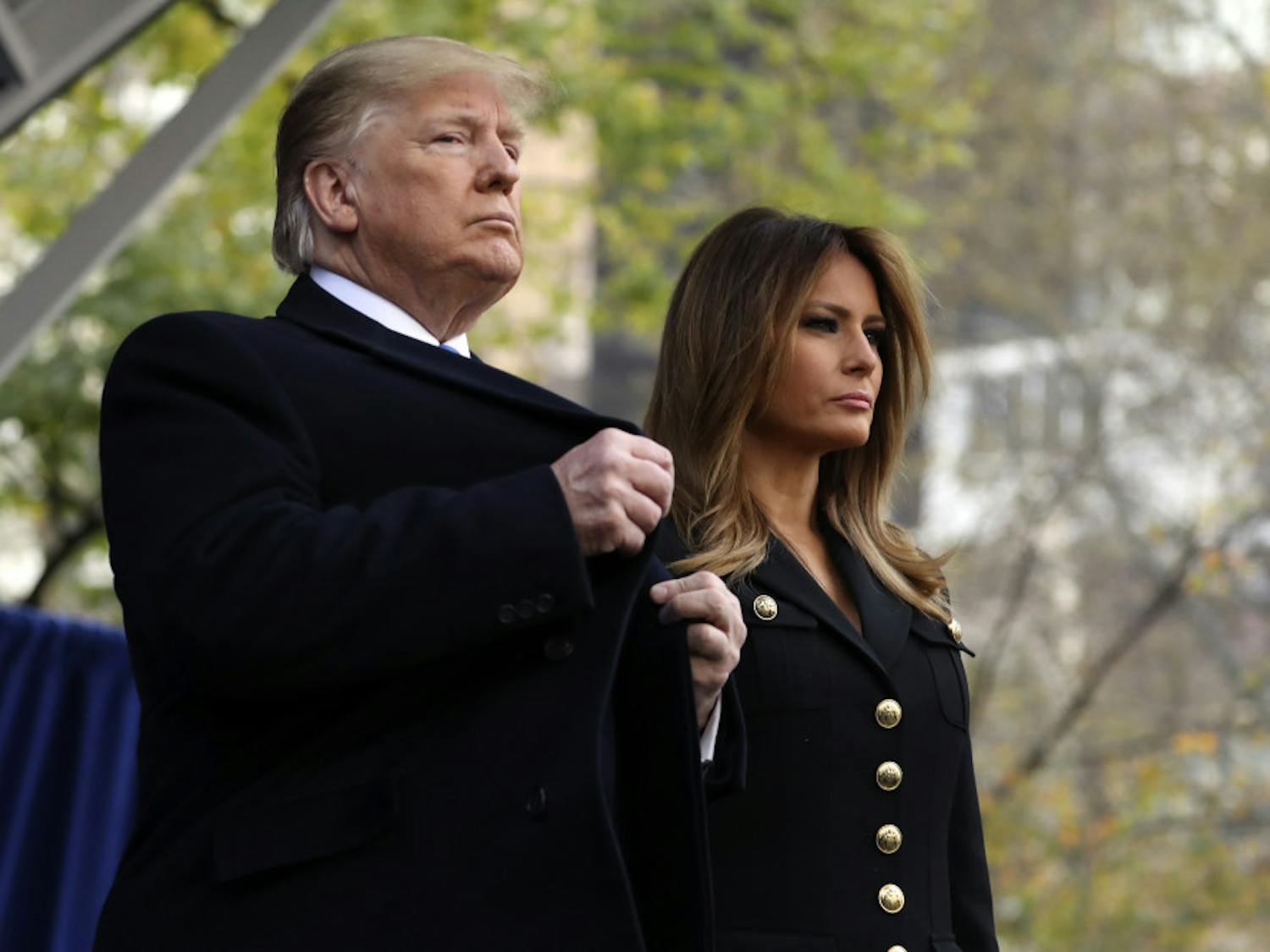 President Donald Trump and first lady Melania Trump attend ceremony at the New York City Veterans Day Parade at Madison Square Park in New York, Monday, Nov. 11, 2019. (AP Photo/Andrew Harnik)