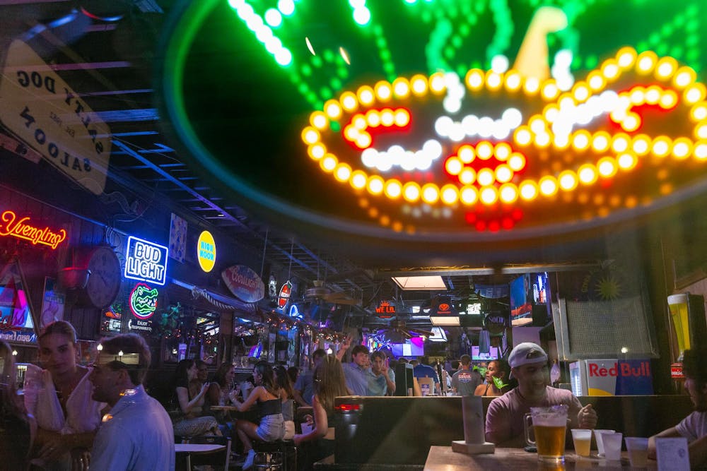 Students enjoy drinks prior to the first day of classes inside of the Salty Dog Saloon on Wednesday, August 21, 2024.