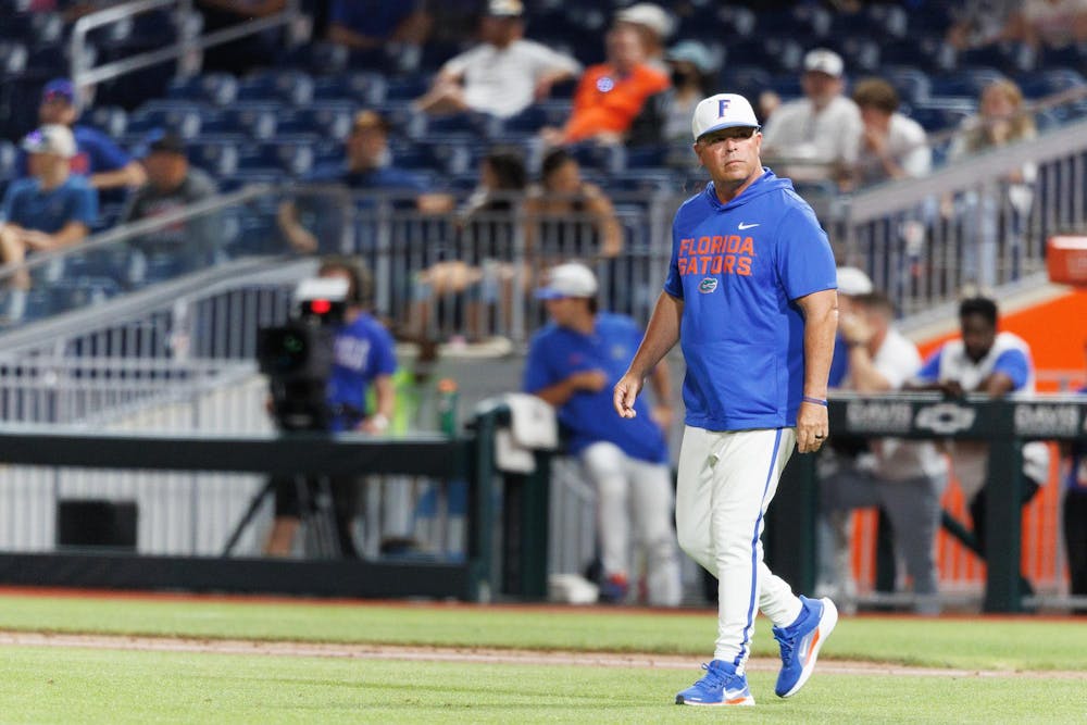 Florida head coach Kevin O’Sullivan walks to the mound for a pitching change during an NCAA baseball game against Bethune-Cookman University, Tuesday, April 14, 2026, in Gainesville, Fla.