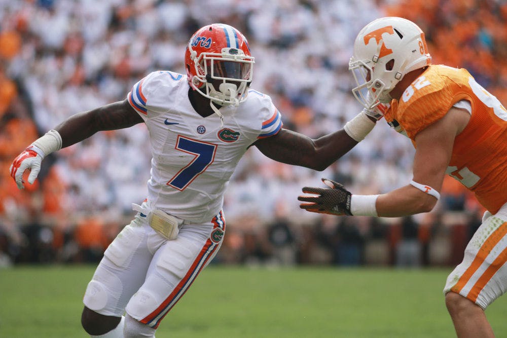 <p>Florida's Duke Dawson (7) covers Tennessee tight end Ethan Wolf during the Gators' 10-9 win against the Volunteers on Saturday at Neyland Stadium in Knoxville, Tenn.</p>