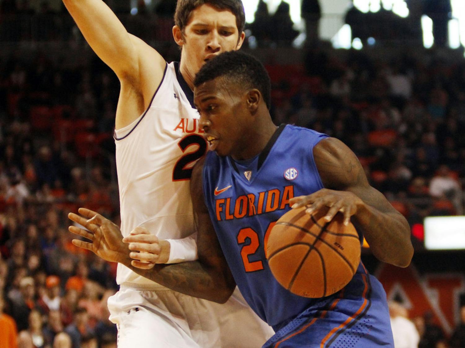 Florida forward Casey Prather (24) drives past Auburn forward Alex Thompson during the No. 7 Gators' 68-61 win against the Tigers on Saturday in Auburn Arena.