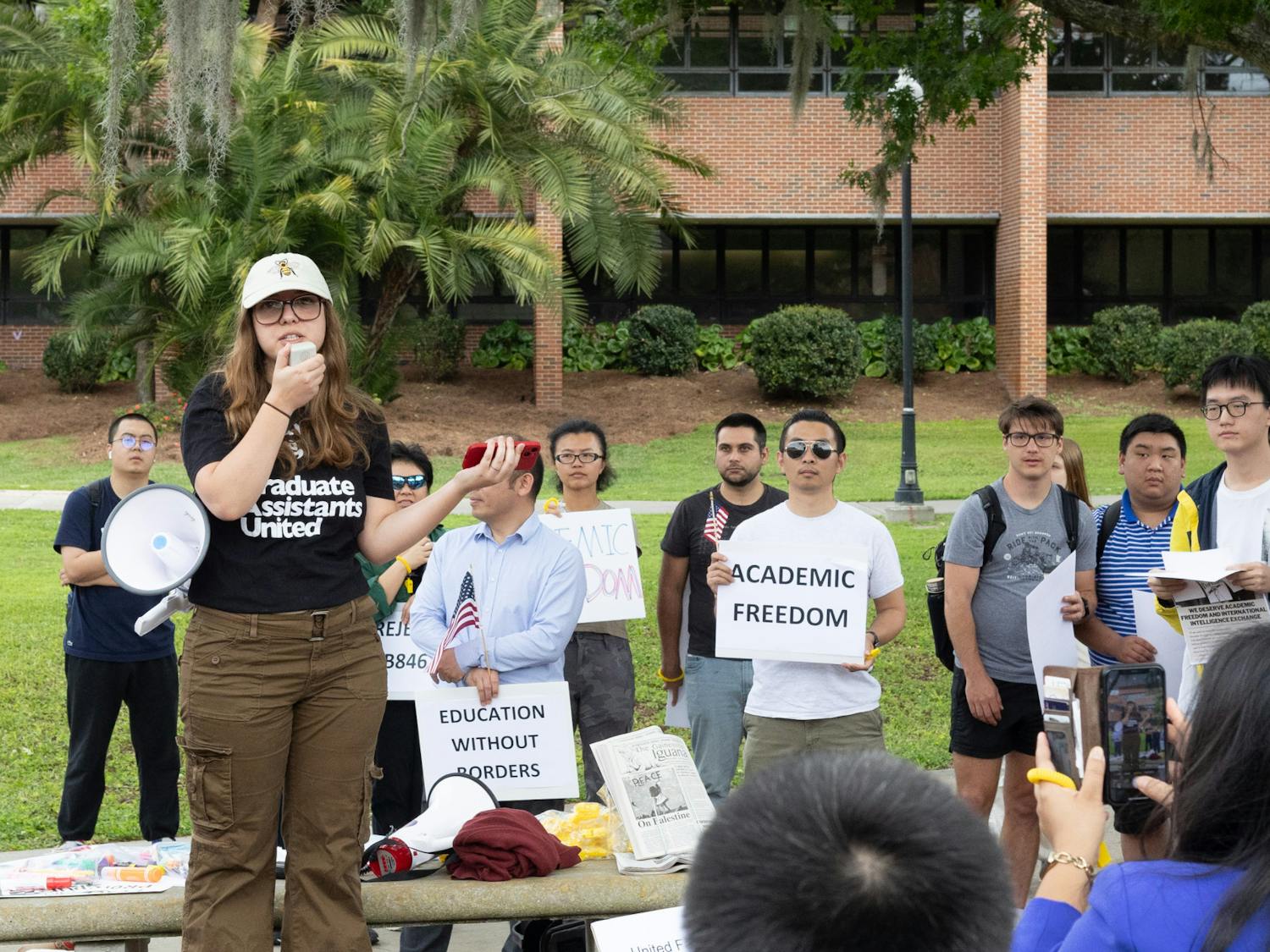 Protesters gather outside of the Reitz Union on Tuesday, March 26, 2024 to protest legislation blocking international students from Florida colleges and universities.