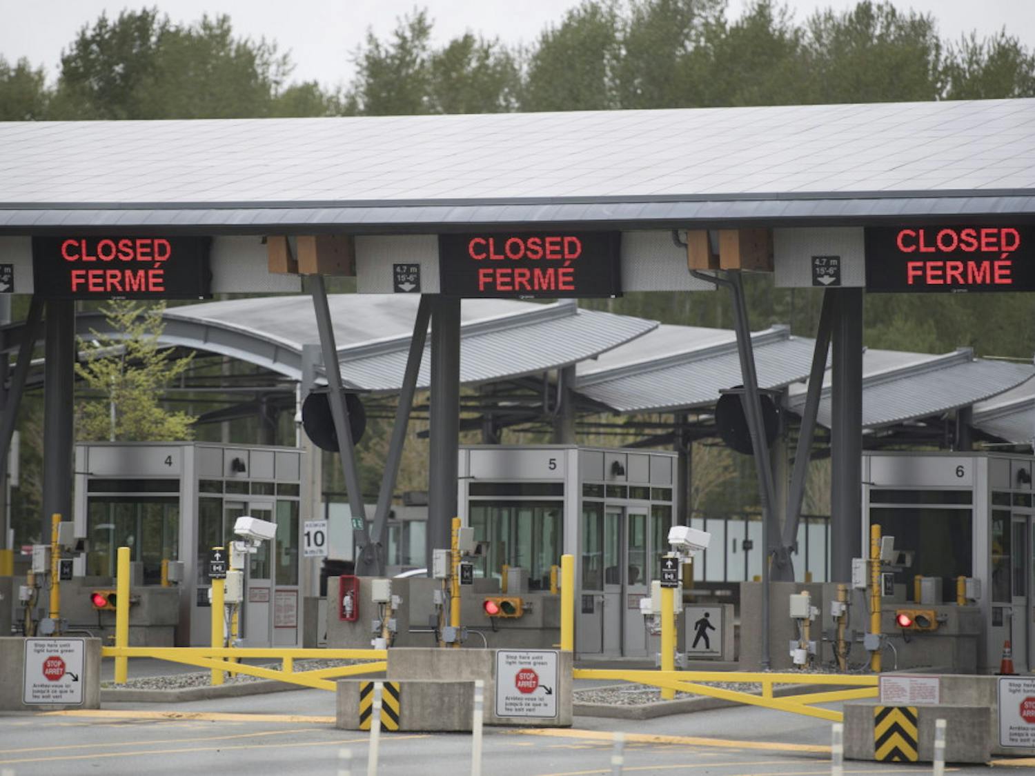 Part of Canada's land border with the United States is pictured closed at the Peace Arch border crossing in Surrey, British Columbia, Tuesday, April 28, 2020. (Jonathan Hayward/The Canadian Press via AP)