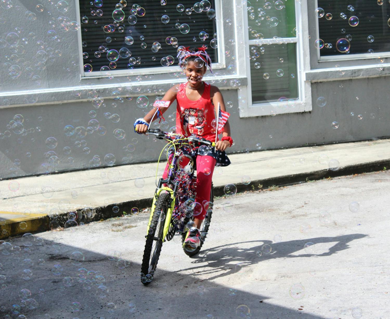 Bouncers held its second annual Fourth of July Bicycle Parade with a turnout of less than a tenth of what it was in 2019.
A year prior, 100 kids attended. This year, only eight came to ride their bicycles, tricycles, and scooters around the parking lot. Angie Adams, manager of Bouncers Indoor Playground, attributed the reduced turnout to the pandemic but proceeded with the event because she says “It’s still important to celebrate the Fourth of July.”
