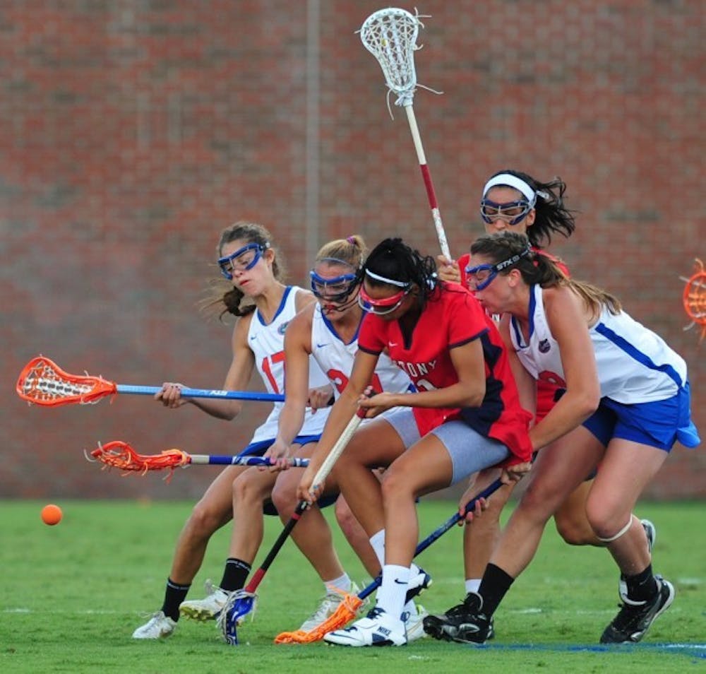 <p align="justify">Freshman midfielder Shannon Gilroy (right) competes for a draw control during a match with Stony Brook on March 14. Despite suffering a torn ACL last June, Gilroy has scored 17 goals and leads UF in draw controls.</p>