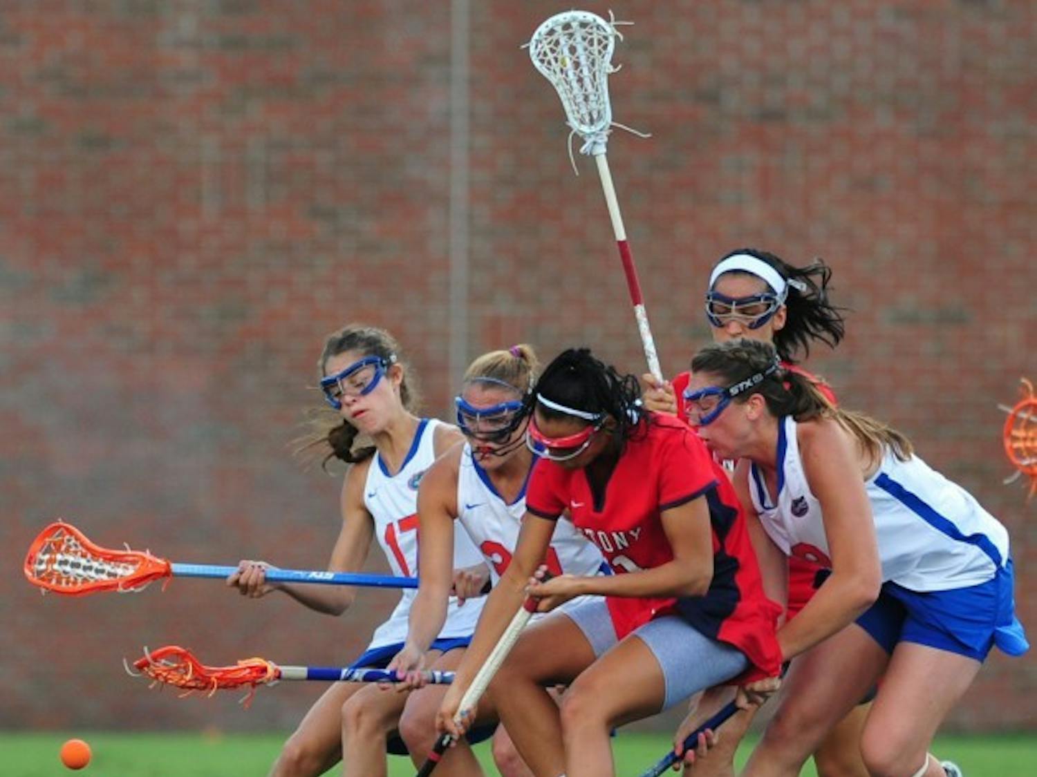 Freshman midfielder Shannon Gilroy (right) competes for a draw control during a match with Stony Brook on March 14. Despite suffering a torn ACL last June, Gilroy has scored 17 goals and leads UF in draw controls.