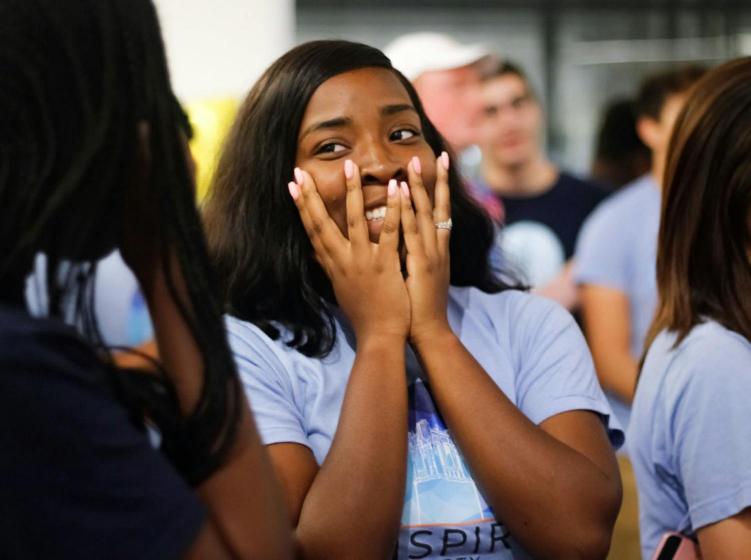 Daziah Scurry, a 19-year-old UF sophomore studying political science and telecommunications, anxiously listens to the long list of Inspire party losses in the Reitz Union on Wednesday night.