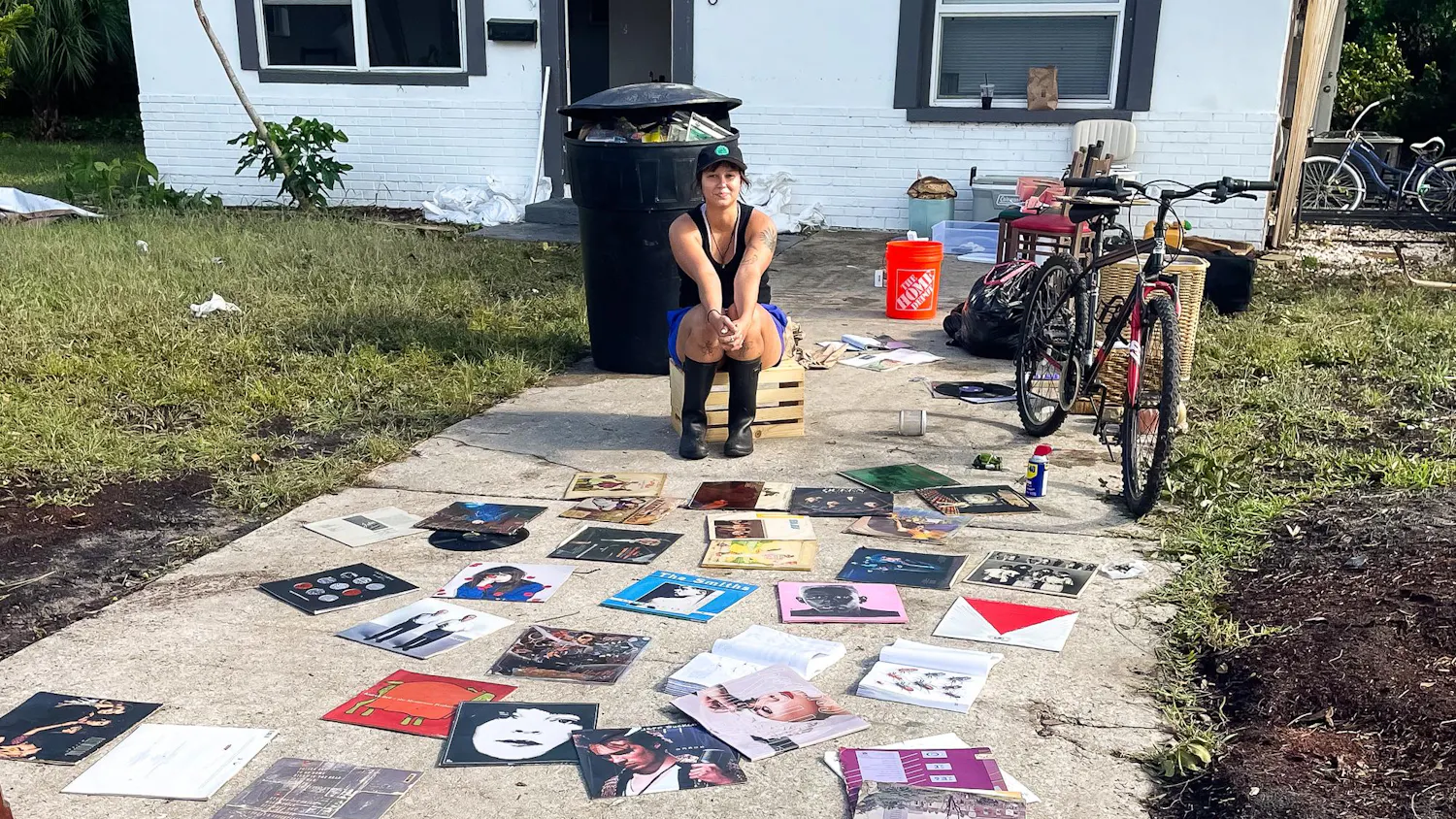 Mackenzie Spiroff dries her record collection after Hurricane Helene flooded her St. Petersburg neighborhood. Photo courtesy of Mackenzie Spiroff.