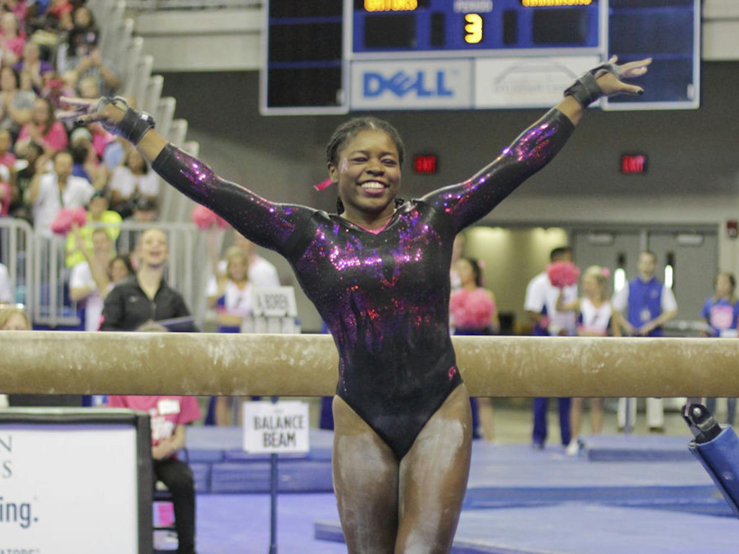 Alicia Boren poses after completing her beam routine during Florida's win over Arkansas on Feb. 12, 2016, in the O'Connell Center.