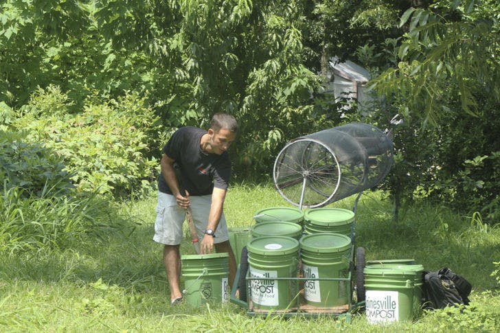 Chris Cano, a founder of Gainesville Compost, helps out at Porters Community Farm. He said Gainesville Compost helps supply the farm with fresh compost for its crops.