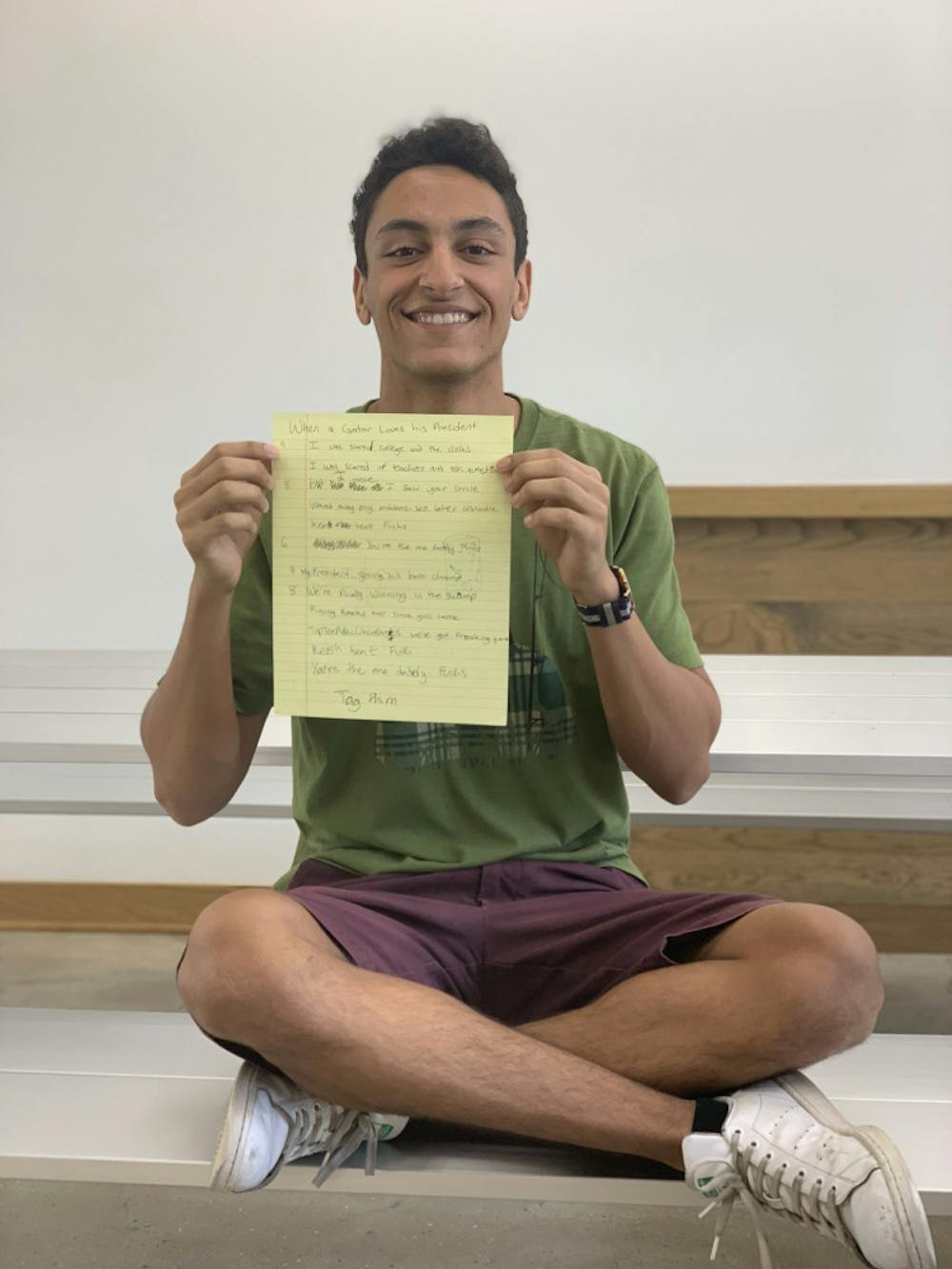 <p><span id="docs-internal-guid-c2baf636-7fff-9963-c34a-0c9554b03001"><span>Zakaria Bennouna, a 19-year-old UF mechanical engineering sophomore, holds the lyrics to his viral song “When a Gator Loves his President.” Lyrics include: “Kent Kent Fuchs, you’re the one, daddy Fuchs.”</span></span></p>
