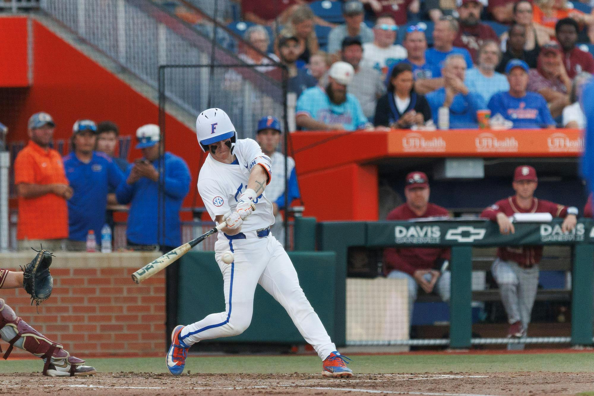 Florida infielder Colton Schwarz (49) swings his bat during an NCAA baseball game against Florida State University, Tuesday, March 10, 2026, in Gainesville, Fla.