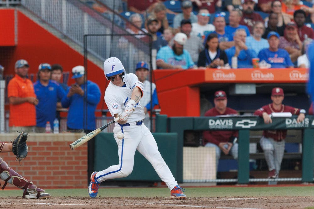 Florida infielder Colton Schwarz (49) swings his bat during an NCAA baseball game against Florida State University, Tuesday, March 10, 2026, in Gainesville, Fla.