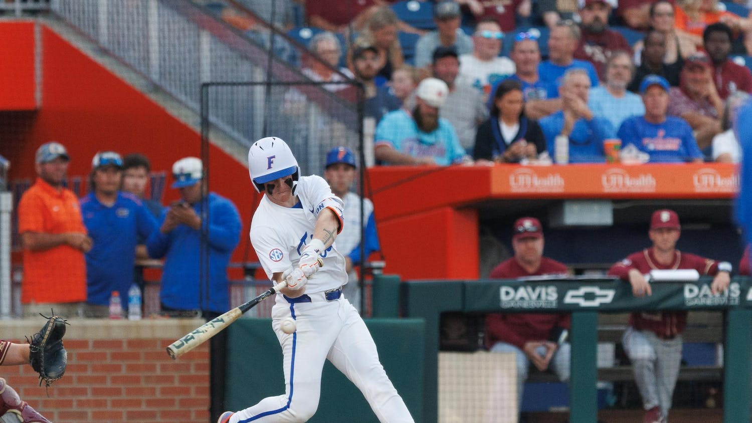 Florida infielder Colton Schwarz (49) swings his bat during an NCAA baseball game against Florida State University, Tuesday, March 10, 2026, in Gainesville, Fla.