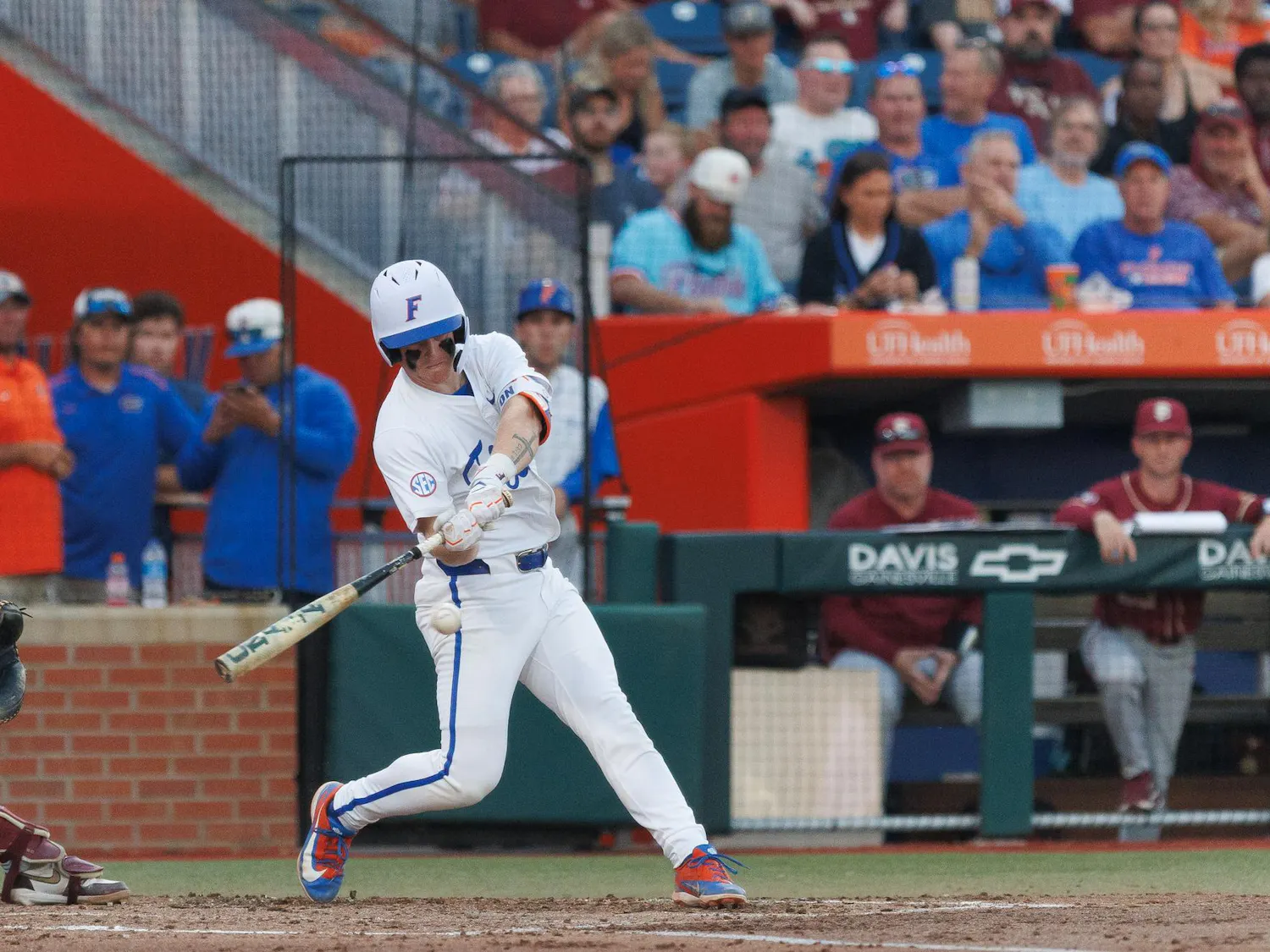 Florida infielder Colton Schwarz (49) swings his bat during an NCAA baseball game against Florida State University, Tuesday, March 10, 2026, in Gainesville, Fla.