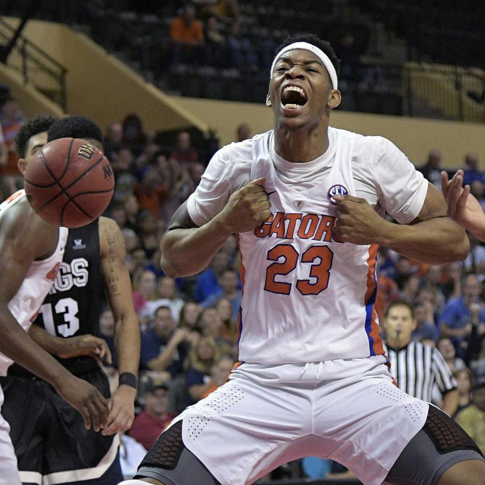 Florida forward Justin Leon (23) celebrates after dunking during the first half of an NCAA college basketball game against Gonzaga at the AdvoCare Invitational tournament in Lake Buena Vista, Fla., Friday, Nov. 25, 2016. (AP Photo/Phelan M. Ebenhack)