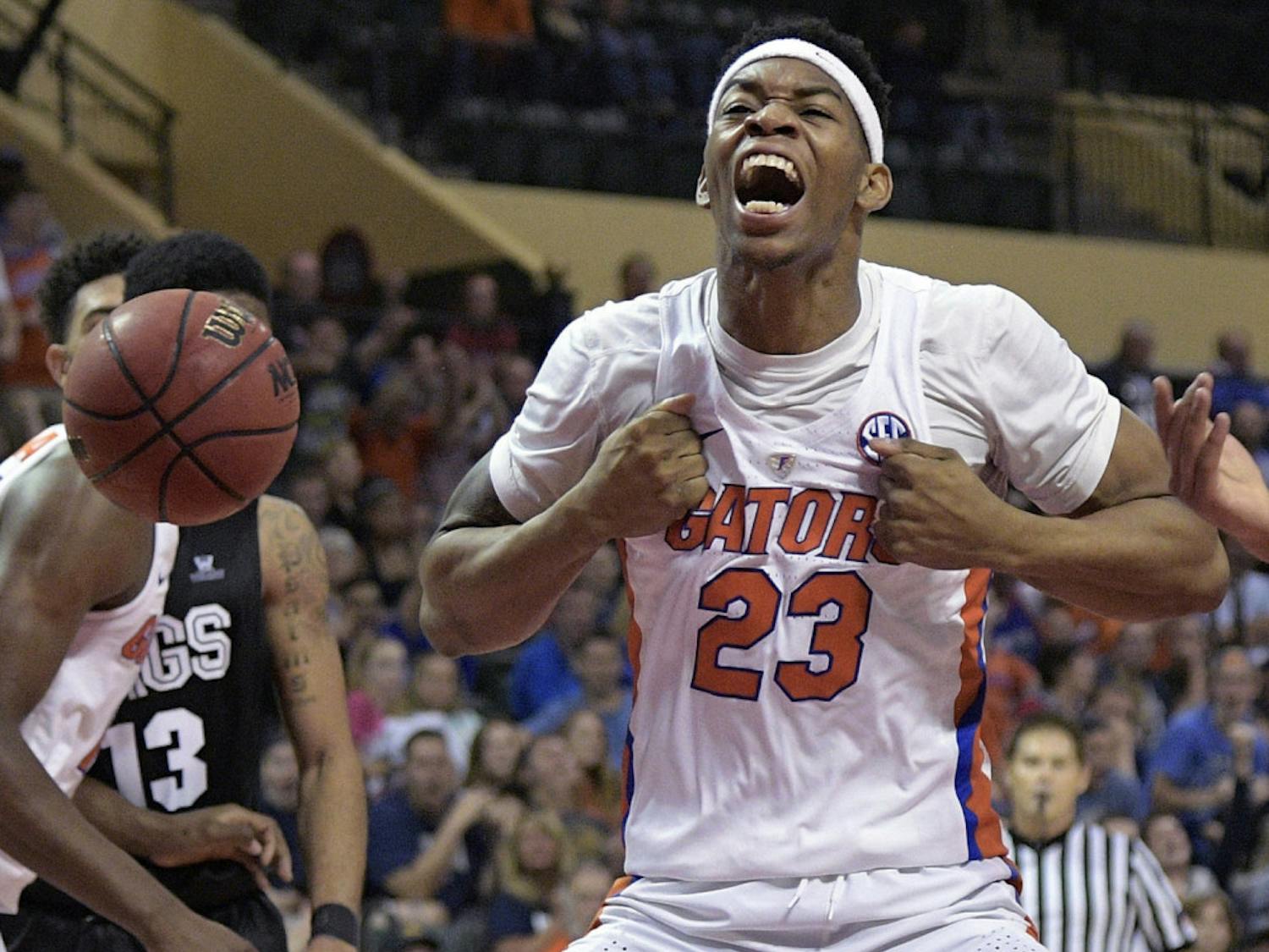 Florida forward Justin Leon (23) celebrates after dunking during the first half of an NCAA college basketball game against Gonzaga at the AdvoCare Invitational tournament in Lake Buena Vista, Fla., Friday, Nov. 25, 2016. (AP Photo/Phelan M. Ebenhack)