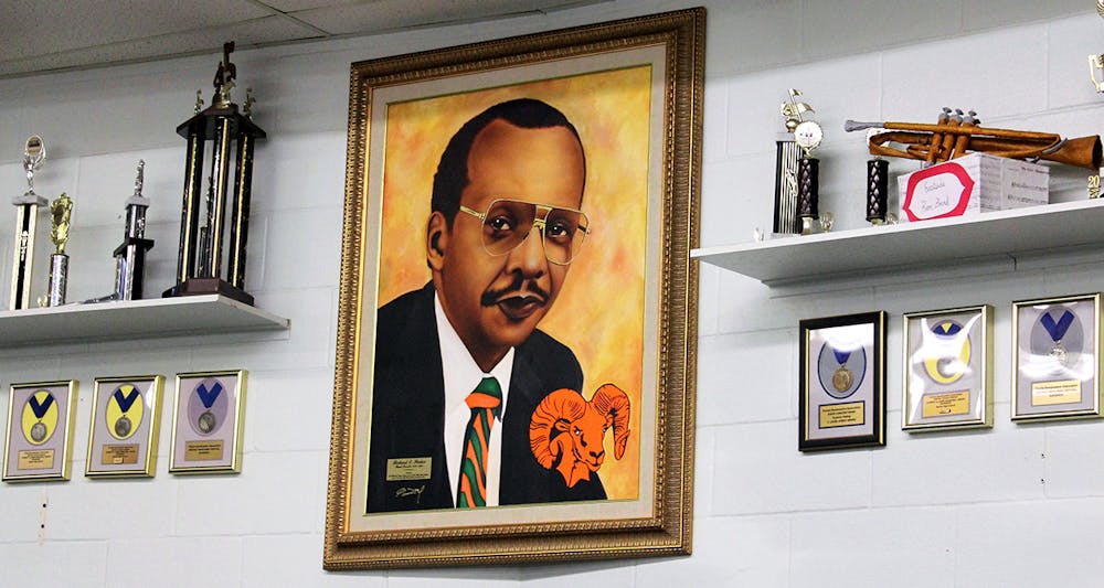A portrait of former band director Richard E. Parker hangs inside the band room at Eastside High School on Friday, Feb. 12, 2021. Parker was the Eastside marching band director from 1970 to 1990.