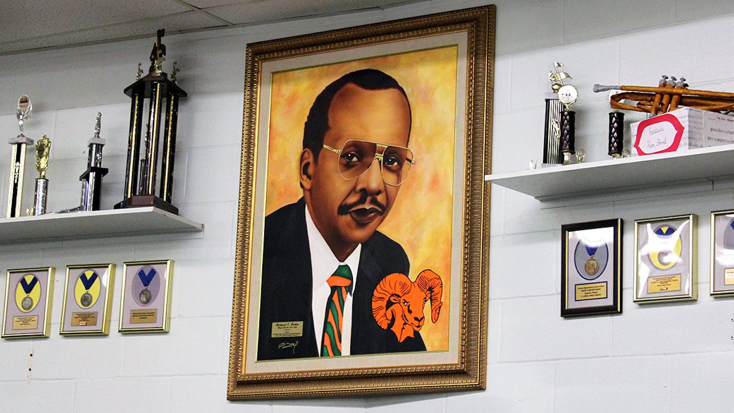 A portrait of former band director Richard E. Parker hangs inside the band room at Eastside High School on Friday, Feb. 12, 2021. Parker was the Eastside marching band director from 1970 to 1990.