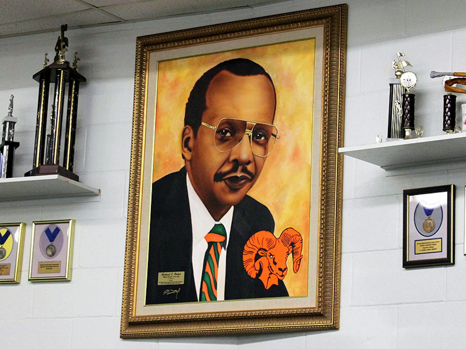 A portrait of former band director Richard E. Parker hangs inside the band room at Eastside High School on Friday, Feb. 12, 2021. Parker was the Eastside marching band director from 1970 to 1990.