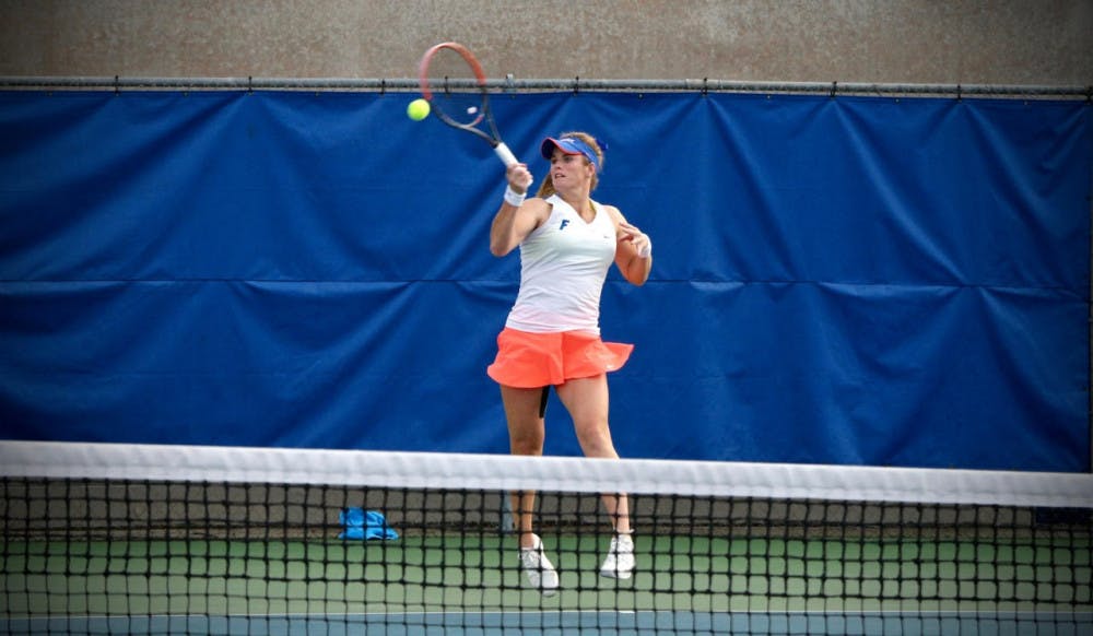 Belinda Woolcock hits a forehand during Florida's 4-2 win against Oklahoma State on Feb. 18, 2017, at the Ring Tennis Complex.